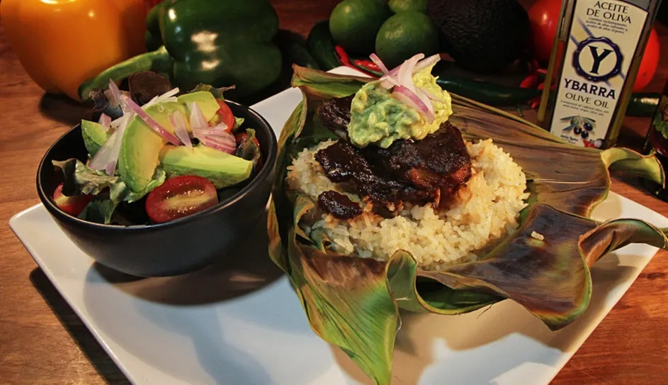 Blackened red snapper on cumin rice with avocado salad