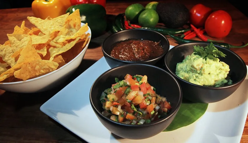 Corn chips with guacamole, pico de gallo and jalapeño salsa